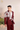 maroon-colored suit with white embroidery