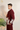 maroon-colored suit with white embroidery