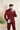 maroon-colored suit with white embroidery