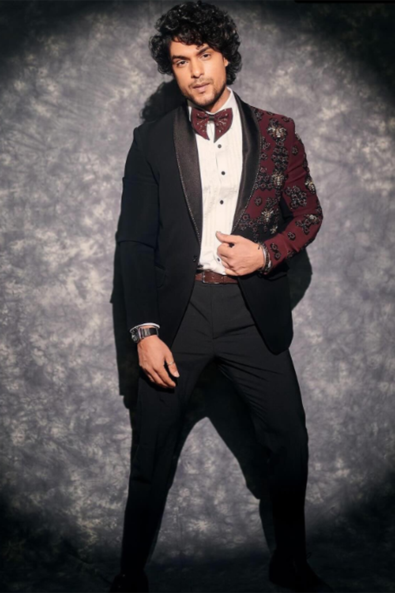 ANKIT GUPTA in Our Rich black textured suit